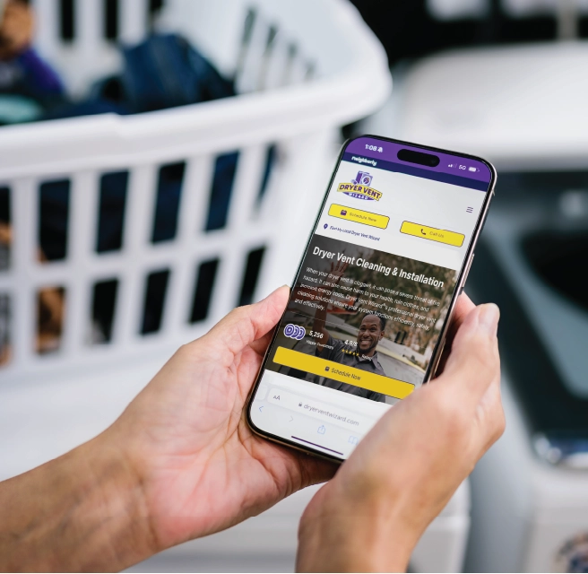 Homeowner views Dryer Vent Wizard website on her cell phone to inquire about an appointment for residential dryer vent cleaning.