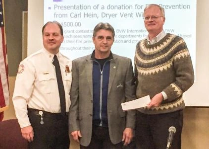 Dryer Vent Wizard awarding grant to Fire Department