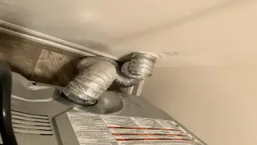 Crushed vent behind a dryer causing long dry times, 2 to 3 cycles