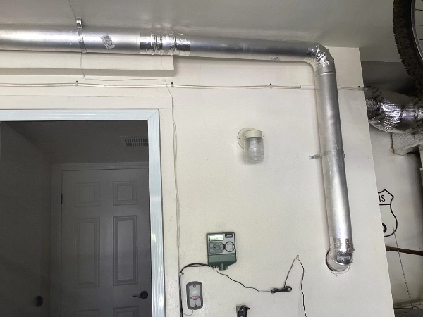 A picture of a newly installed dryer vent system.